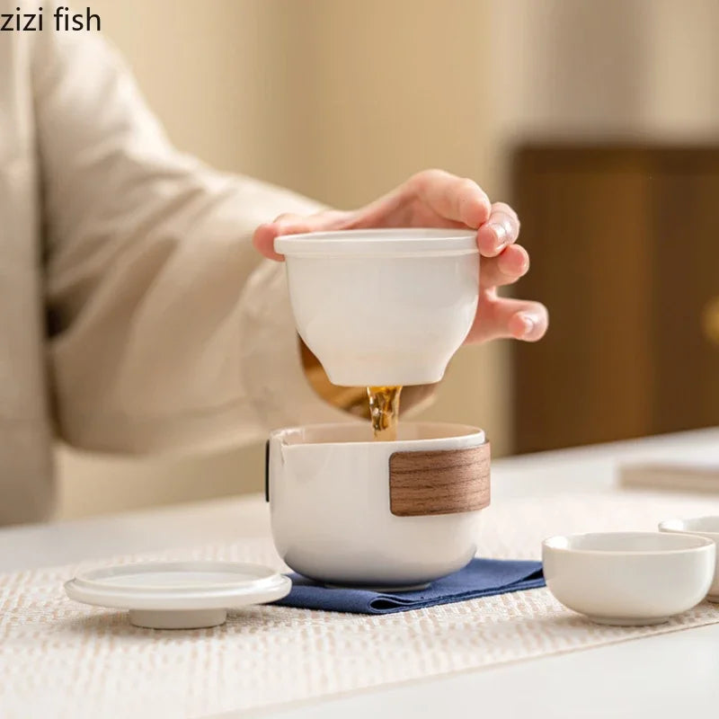 Service à thé de voyage en plein air, service à thé Kung Fu en céramique, service à thé Portable, théière, tasse à thé, infuseur d'eau, séparateur d'eau, Pot filtrant