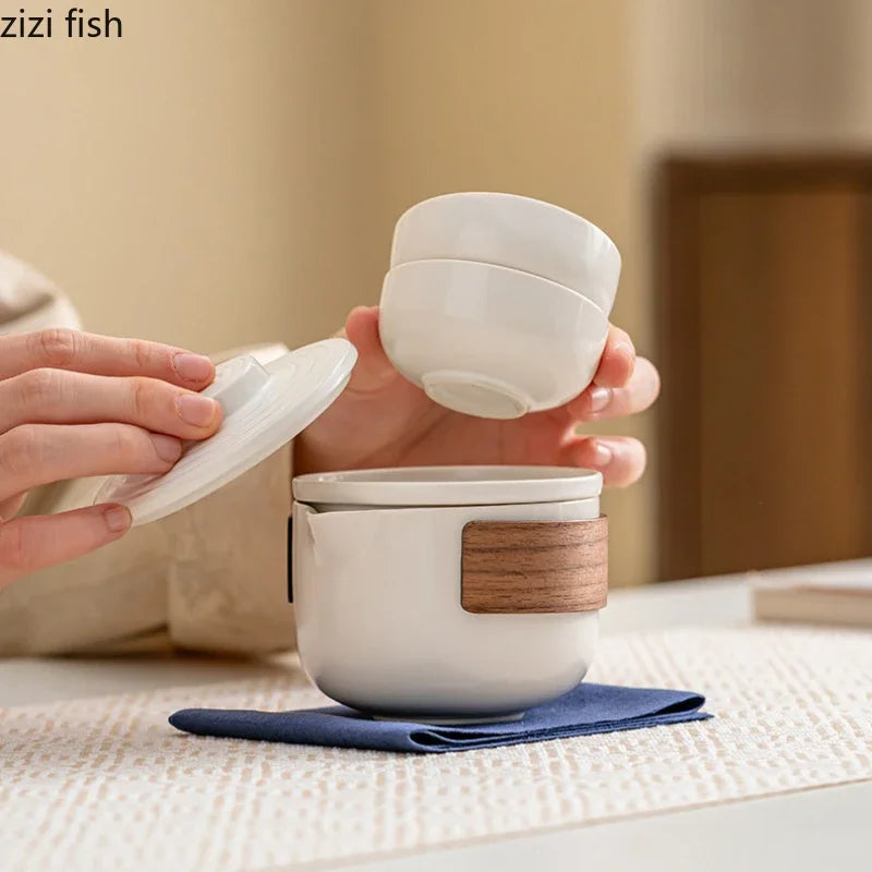 Service à thé de voyage en plein air, service à thé Kung Fu en céramique, service à thé Portable, théière, tasse à thé, infuseur d'eau, séparateur d'eau, Pot filtrant