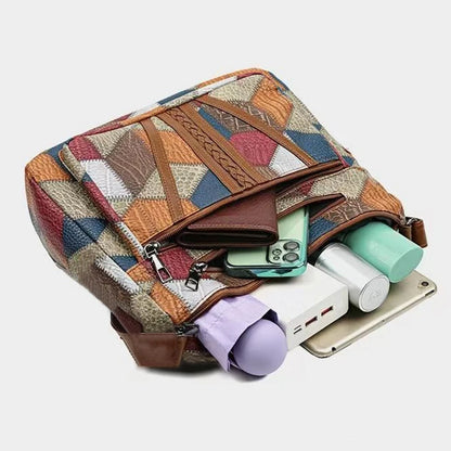 Lady's mother bag with geometric pattern design, suitable for traveling and shopping. Made of PU material.